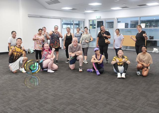 Class members grouped for a photo at the end of a class.